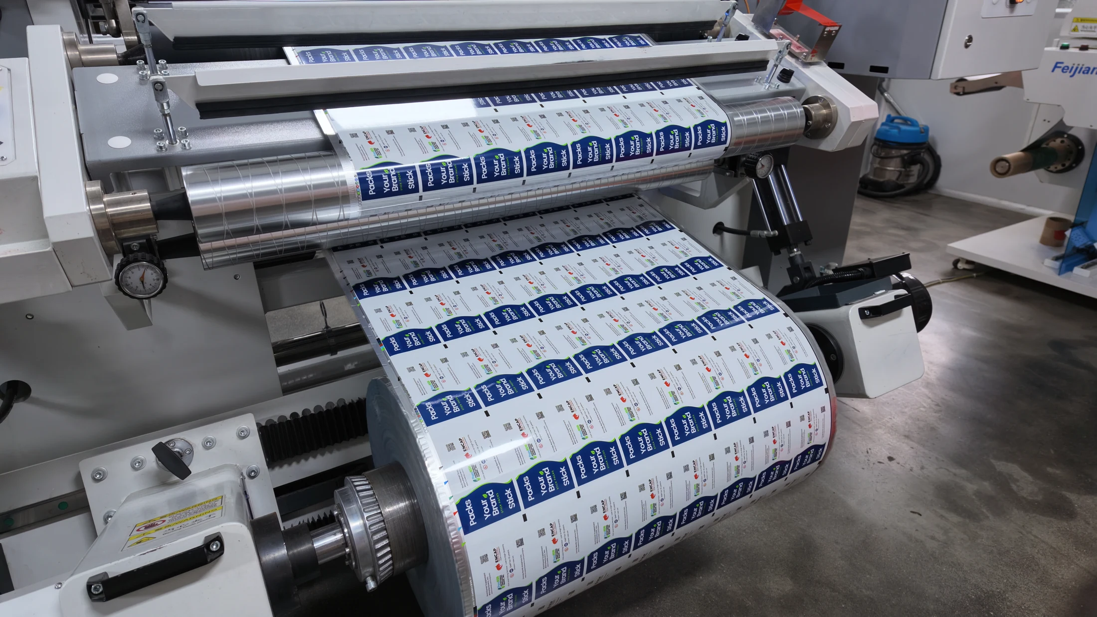 Printed Encap rollstock running over production equipment